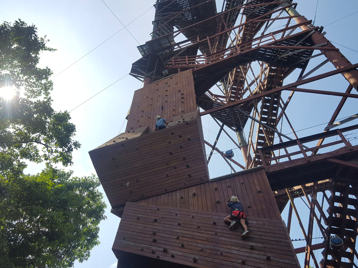 climbers on the adventure tower climbing wall