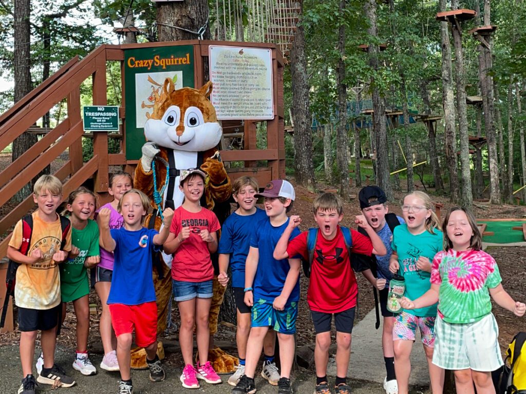 smiling kids with the crazy squirrel mascot