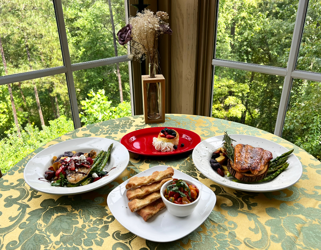 Gourmet Dinning with the Couples Getaway Showing Salmon, Bruschetta, Pork, and Cheesecake