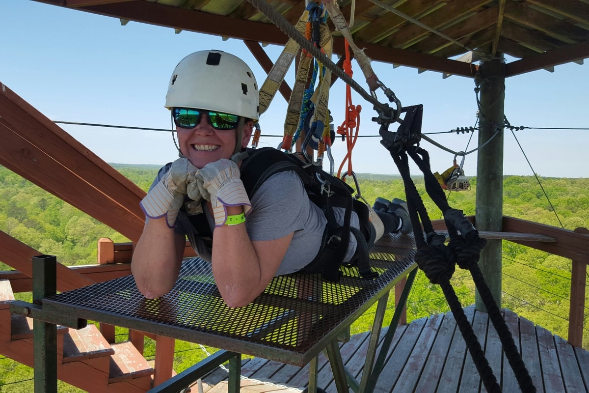 preparing for flight of the falcon on all day zipline tour